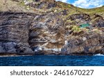 Settlement in a cave, Poris de Candelaria, Cueva de Candeleria, Pirate Bay, Island La Palma, Canary Islands, Spain, Europe. 
Fishermen`s houses at the hidden smugglers bay near Tijarafe.