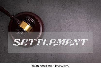 Settlement. Conflict, Dispute And Mediation Process. Judge's Hammer On A Concrete Background.