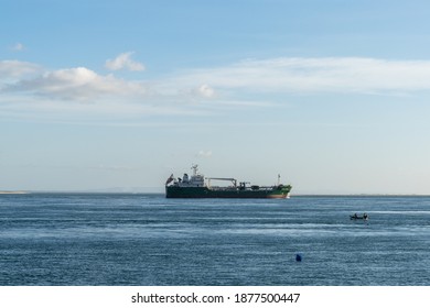 Setubal, Portugal - 17 December, 2020: Large Freight Ship Leaving The Industrial Port At Setubal For A Transatlantic Crossing