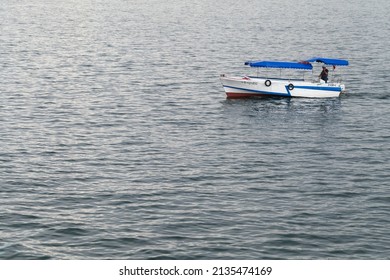 Sevastopol, Crimea - March 5, 2018: Small Tourist Boat With A Captain Sails The Sevastopol Bay