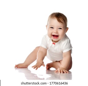 Seven Month Infant Child Baby Toddler Sitting And Happy Looking Laughing At The Corner With Text Space Isolated On A White Background