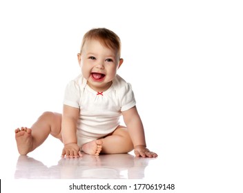 Seven Month Infant Child Baby Toddler Sitting And Happy Looking Laughing At The Corner With Text Space Isolated On A White Background