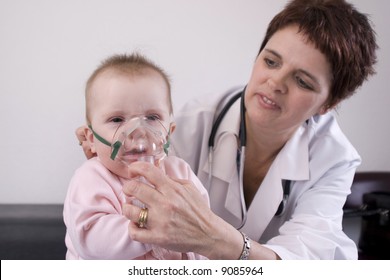 Seven Month Old Baby With A Nebulizer Mask.