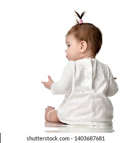 Seven Month Old Infant Baby Girl Toddler Sitting Backside View Isolated On A White Background