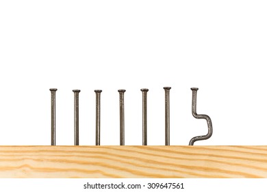 seven nails,  one  is bent, working week concept, 