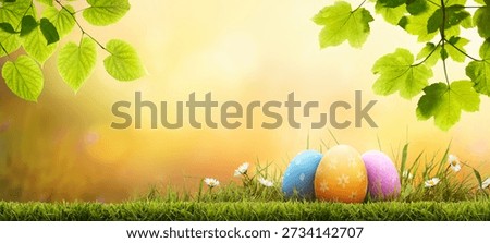 Seven painted easter eggs celebrating a Happy Easter on a spring day with a green grass meadow, bright sunlight, tree leaves and a warm coloured background with copy space.