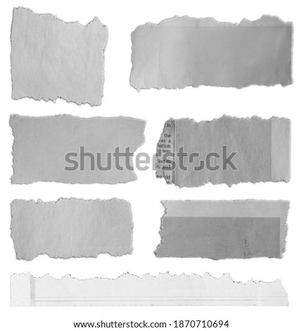 Seven pieces of torn paper on plain background 