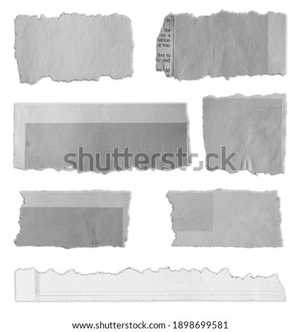 Seven pieces of torn paper on plain background 