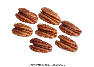 Seven shelled pecan nuts isolated on white background