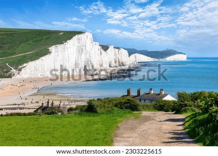 The Seven Sisters Chalk cliffs and the coastguard cottages during a eraly summer day, Seaford, East Sussex, England