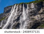 The Seven Sisters waterfall gets its name from, the seven separate streams, the tallest measures 250 meters. The waterfall is located at Geirangerfjord between Geiranger and Hellesylt. 