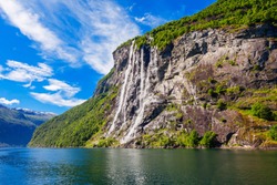 The Seven Sisters Waterfall Over Geirangerfjord, Located Near The Geiranger Village, Norway