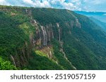 Seven Sisters Waterfalls in Cherrapunji, Meghalaya surrounded by lush green forests during Monsoons