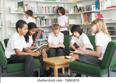 Seven Students In Library Reading Books