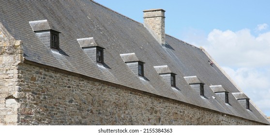 Seven tiny windows at the rear of the Chateau, Chateau de Montfort, Remilly-les-Marais, Saint-Lo, Manche, Normandy, France, Europe on Thursday, 12th, May, 2022