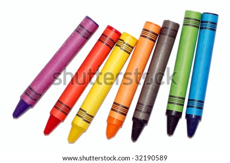 Seven used colored wax crayons with shadows isolated on white