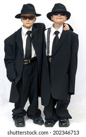 Seven Year Old Twin Boys Dressing Up As Blues Brothers In Adult Clothes.