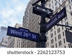 Seventh Avenue and 36th Street street sign at afternoon in NYC - Urban concept and road direction in the center of Manhattan - world famous destination of the American