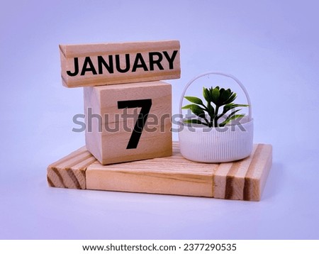Seventh January over wooden blocks 
