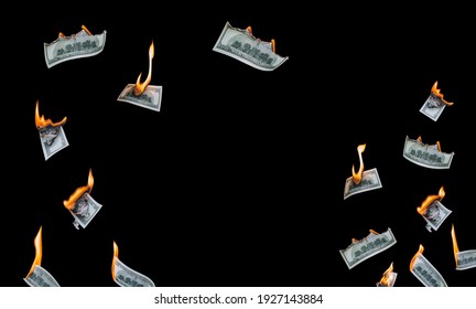 Several 100 dollar bills, falling down, burn on a black background. The concept of bankruptcy, depreciation, devaluation, wastefulness and waste of money. Copy space, isolated.