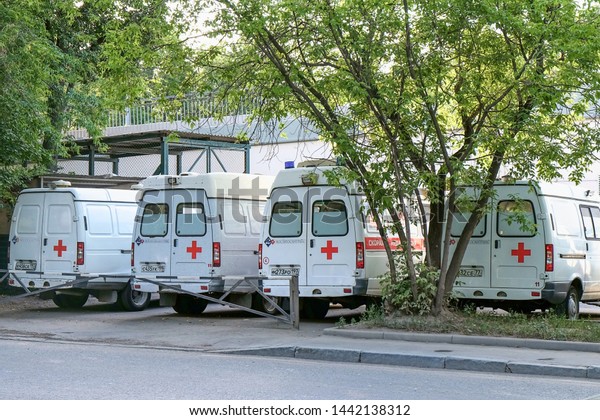 Several ambulances\
waiting for a call at the ambulance station on a summer day ,\
Moscow, Russia, June\
2019