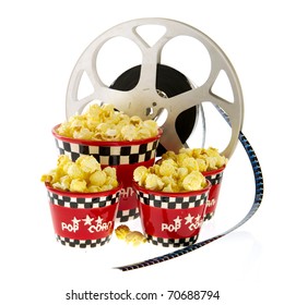 Several Boxes Full With Popcorn And Movie Reel Isolated Over White