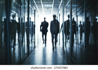 Several Business People Walking Inside Office Building