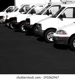 Several Cars Vans And Trucks Parked In Parking Lot For Sale