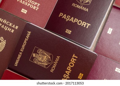 Several Closed Russian And Romanian Passports Lay On The Table