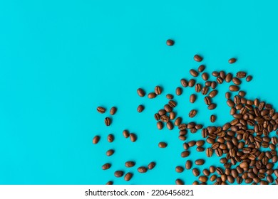 Several coffee beans spilled unique bright background