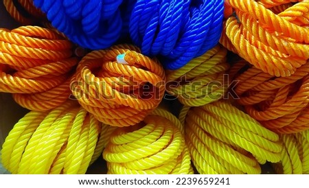 several colored nylon ropes arranged on a store shelf