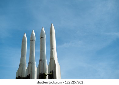 Several combat missiles aimed at the sky. Missile weapons. Nuclear combat are directed. Social problems. Hostilities. Economic instability. Anti-aircraft missile system are directed upwards