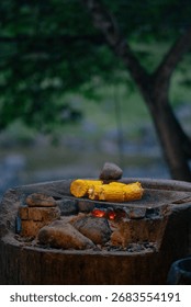 Several corn on grill with some of margerine layered.