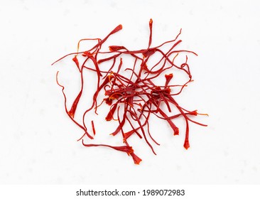 several crocus saffron threads close up on gray ceramic plate