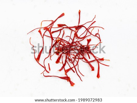 several crocus saffron threads close up on gray ceramic plate