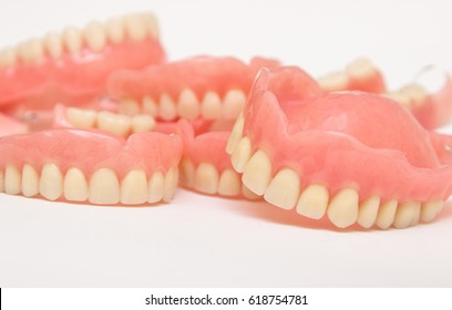 Several dentures on a white background,rapprochement.