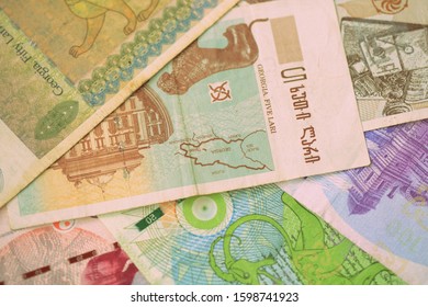 Several different Georgian lari close-up. Money background retro style toned - Shutterstock ID 1598741923