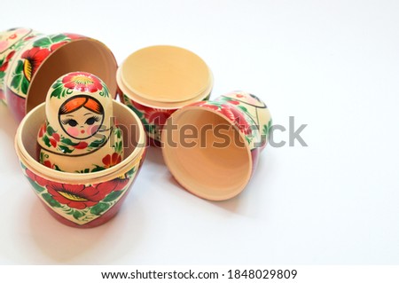 Several disassembled nesting dolls from the set