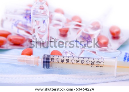 Several drugs, tablets and capsules syringe folded together