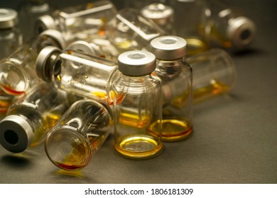 Several empty vials of medicine or vaccine used in the hospital.