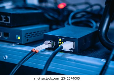 Several ethernet cables linked to a network router for establishing an internet connection