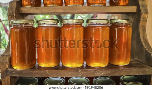 Download Several Flowery Yellow Honey Glass Jar Stock Photo Edit Now 591948206 Yellowimages Mockups