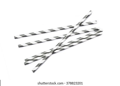 Several gray drinking straws in retro style with gray and white stripes on white background