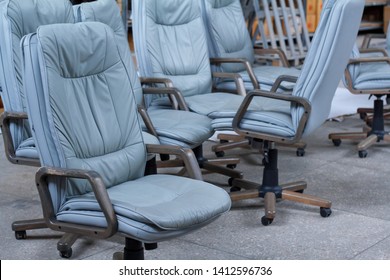 Several Gray Leather Office Chairs Ready For Packaging In A Furniture Warehouse, Online Furniture Store.