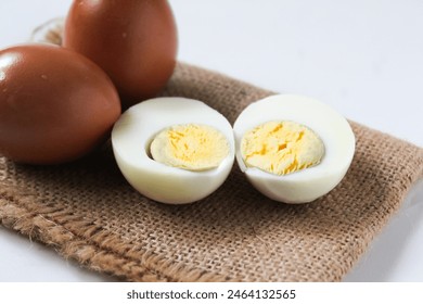 several halved boiled eggs, isolated on a white background - Powered by Shutterstock