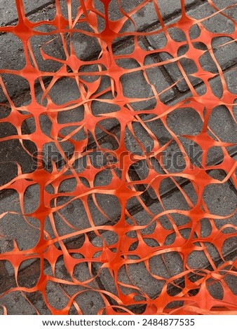 Several layers of orange plastic mesh