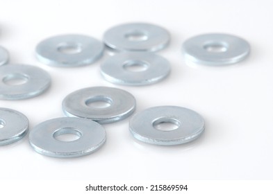 Several Metal Screw Washers Isolated On White Background.