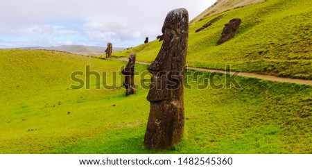 Several Moai lying on the slopes of Rano Raraku, a volcanic crater that was the quarry source of the stone used for the famous monolithic sculptures of Easter Island.