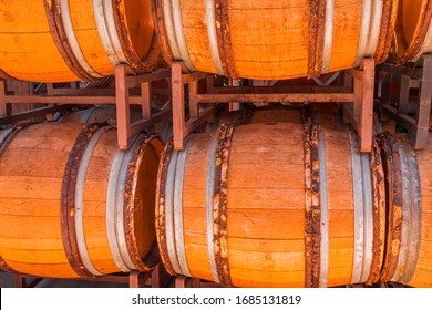 Several Old Wine Barrels Sit Outside On Racks In  Temecula, California, USA. 