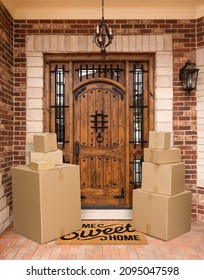 Several Packages Sitting On Home Sweet Home Welcome Mat At Front Door Of House.